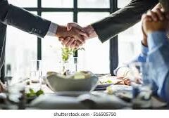 Hand shake hand shake between two people in close up