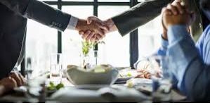 hand shake between two people in close up