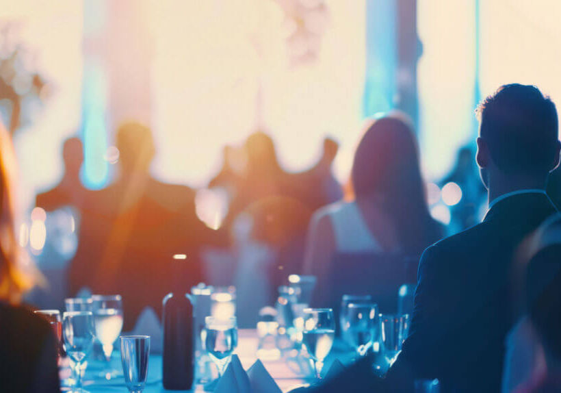 Blurred image of business professionals networking at a corporat Blurred image of business professionals networking at a corporate event